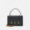Guess IZZY CONVERTIBLE XBODY FLAP - Handbag - Black